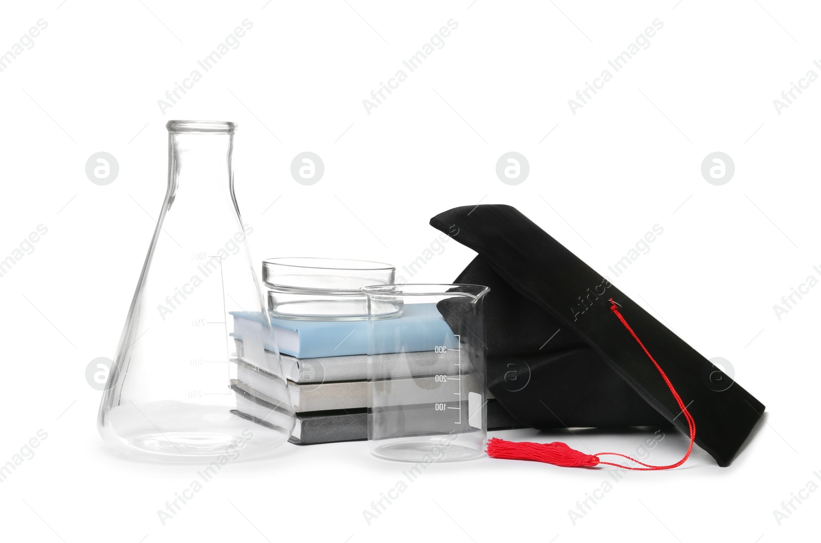 Photo of Medical students stuff, books and graduation hat isolated on white