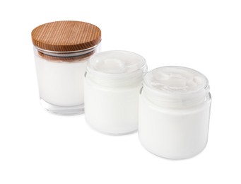 Jars of face cream isolated on white