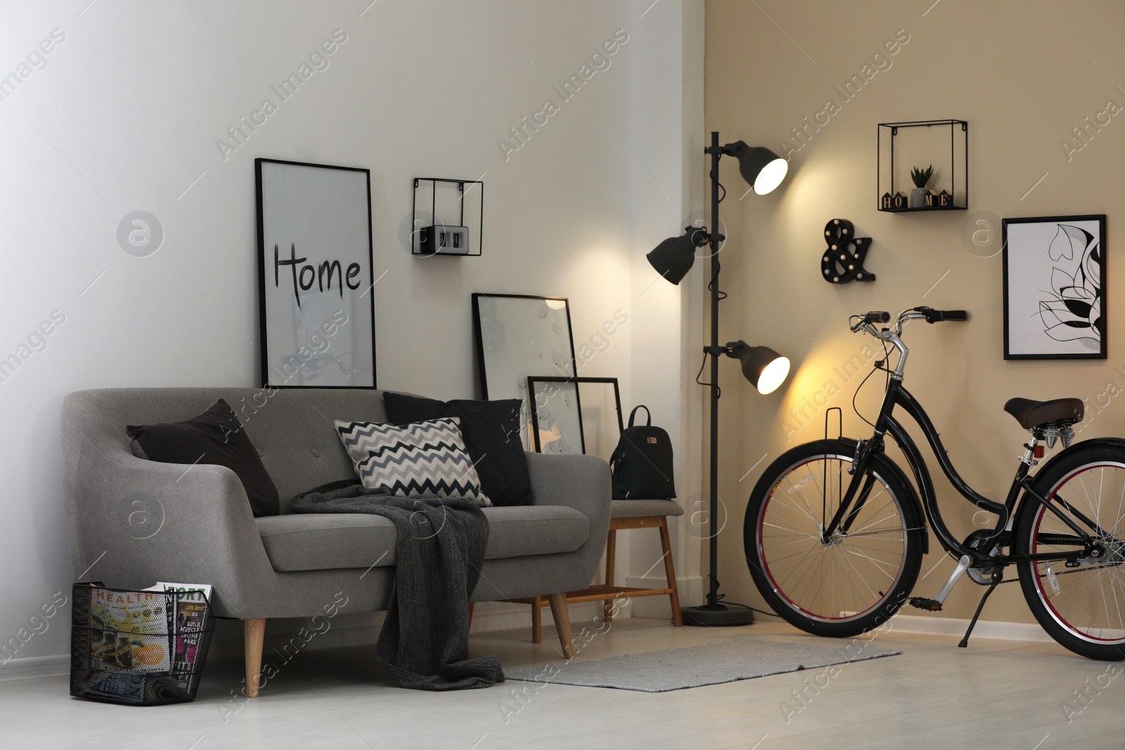 Photo of Modern living room interior with comfortable sofa and bicycle