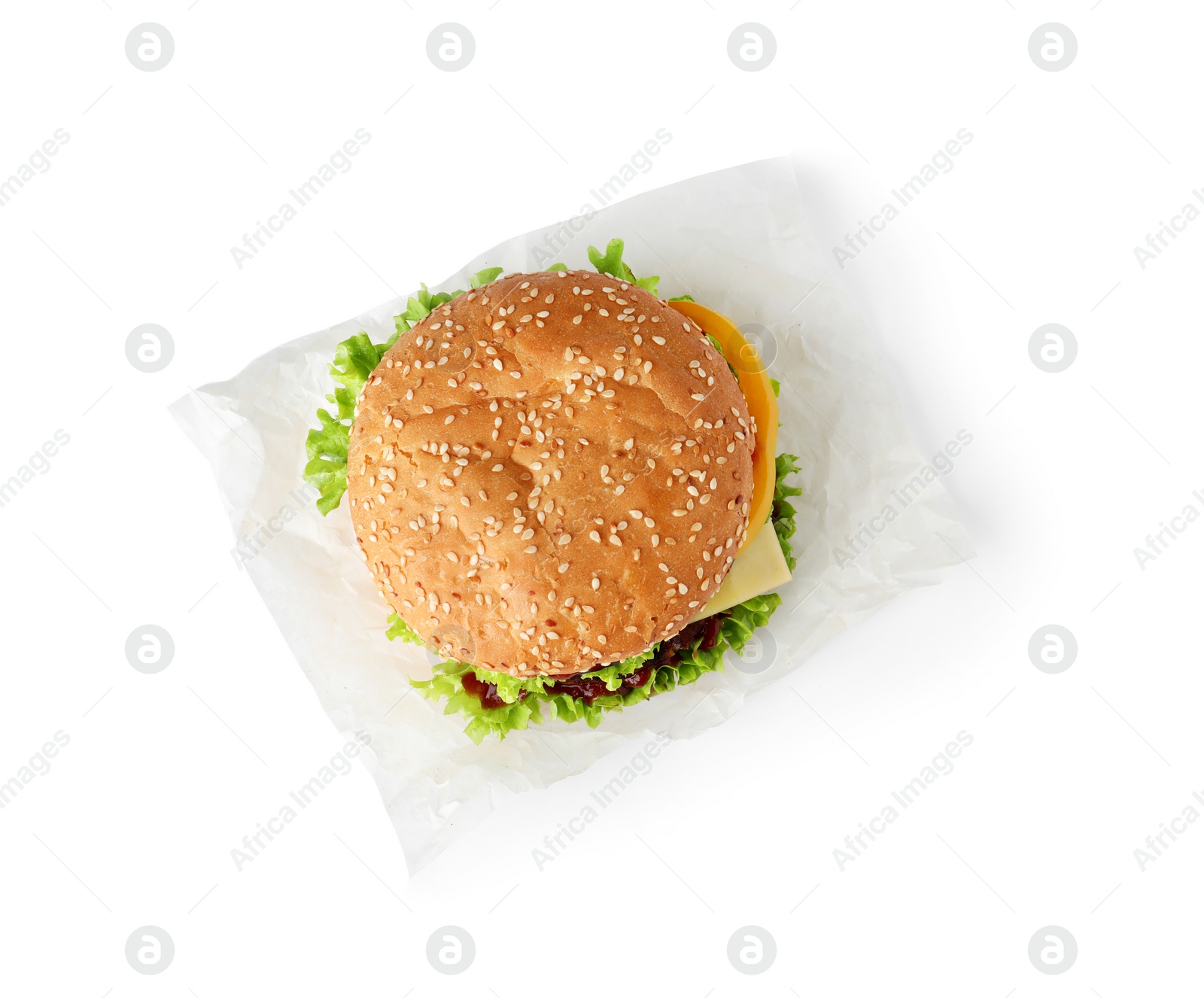 Photo of Parchment with tasty fresh burger isolated on white, top view