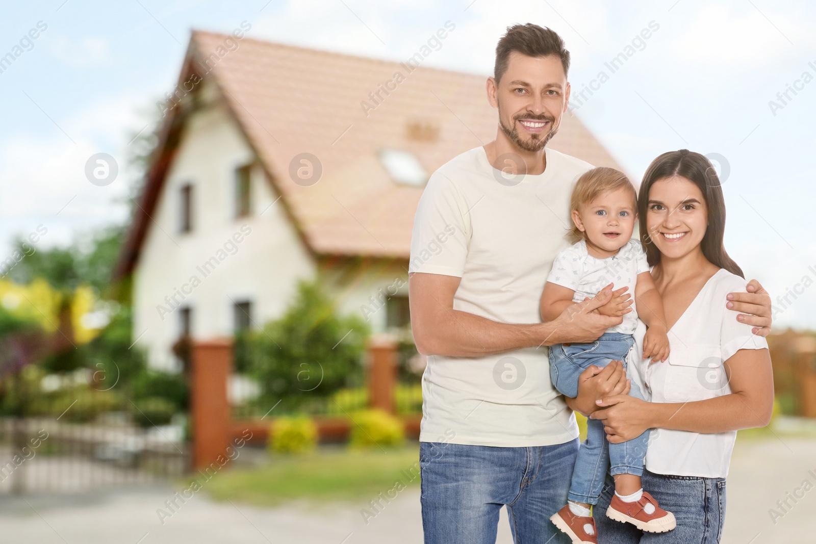 Image of Dream home. Happy family near big beautiful house. Space for text