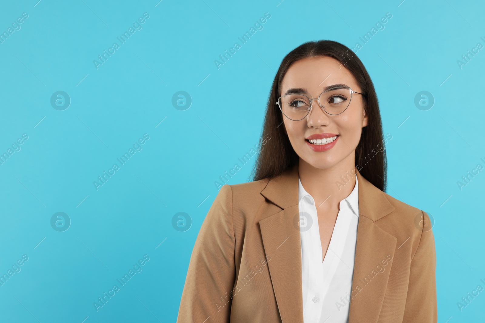 Photo of Beautiful woman wearing glasses on turquoise background, space for text