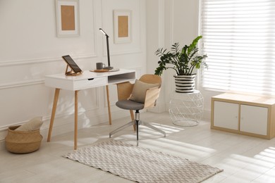 Photo of Stylish rug with pattern on floor in room