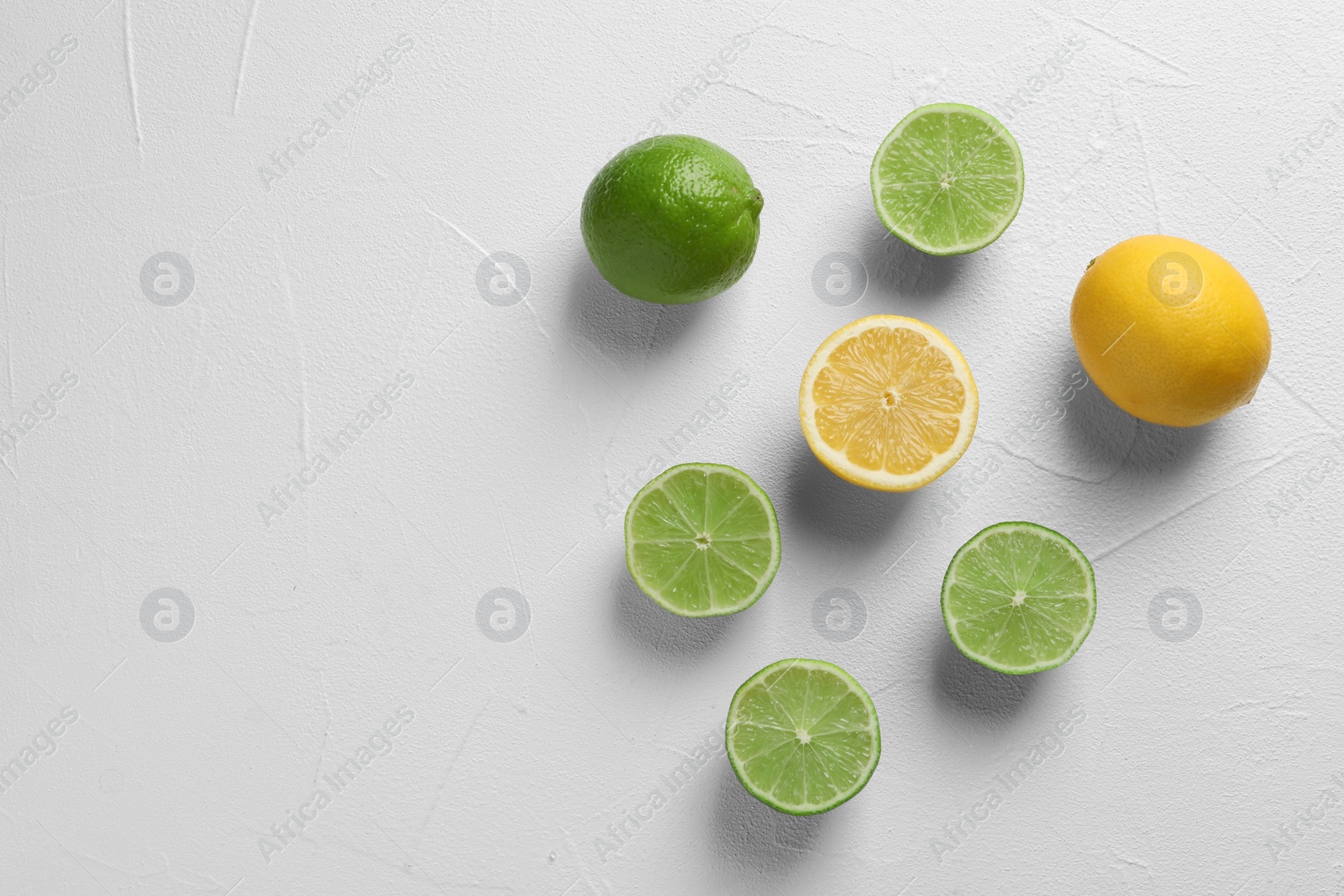 Photo of Flat lay composition with fresh citrus fruits on light background