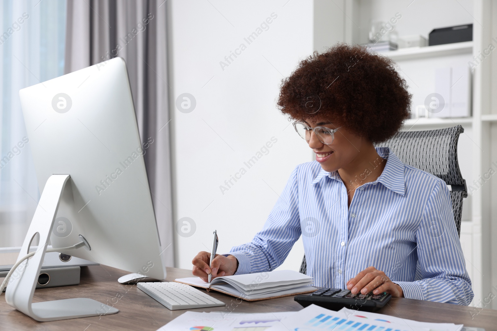 Photo of Professional accountant working at wooden desk in office