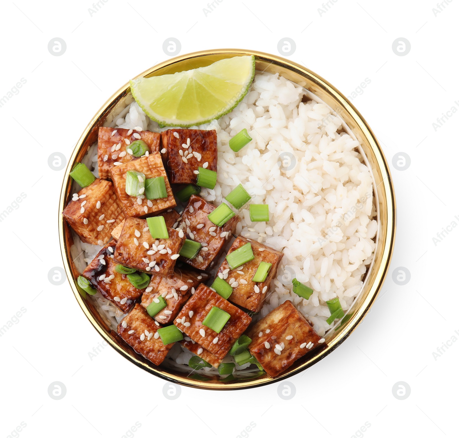 Photo of Bowl of rice with fried tofu and green onions isolated on white, top view