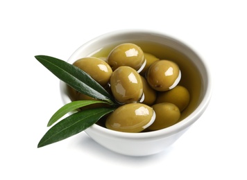 Photo of Bowl with fresh olives in oil on white background