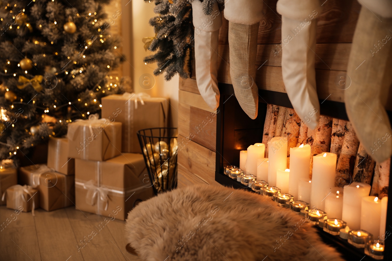 Photo of Stylish room interior with decorative fireplace. Christmas time