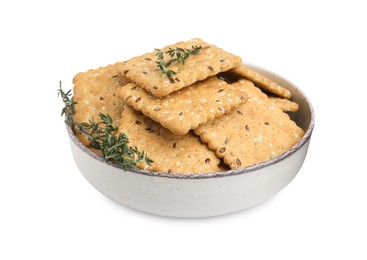 Photo of Cereal crackers with flax, sesame seeds and thyme in bowl isolated on white