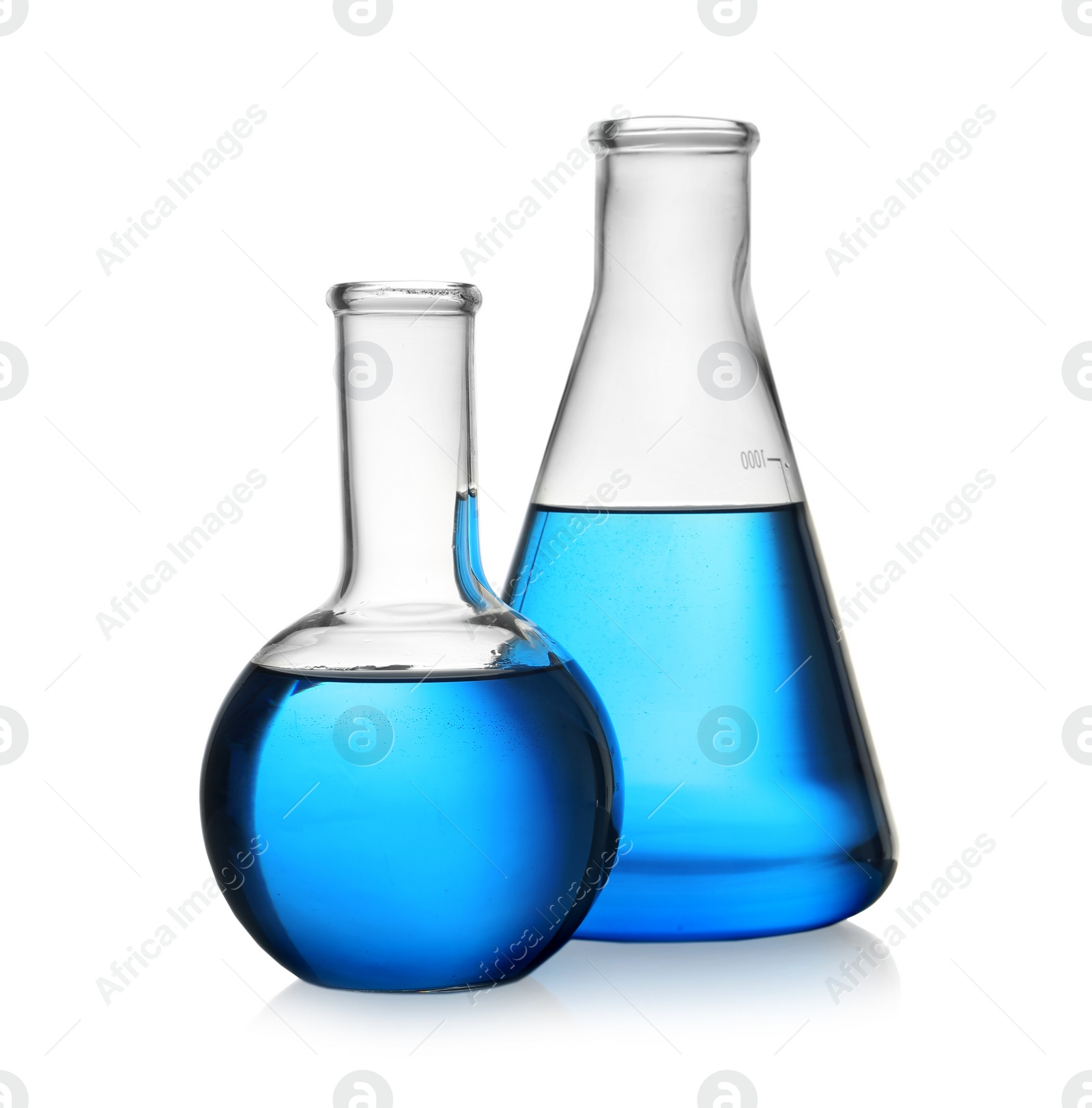 Photo of Florence and conical flasks with blue liquid on white background. Laboratory glassware