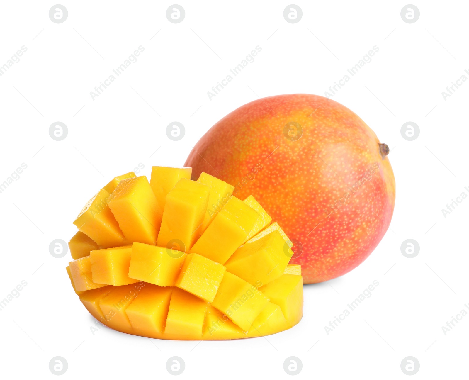 Photo of Delicious whole and cut mangoes on white background