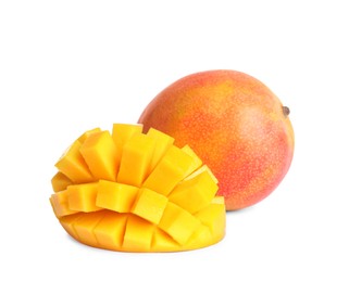 Photo of Delicious whole and cut mangoes on white background