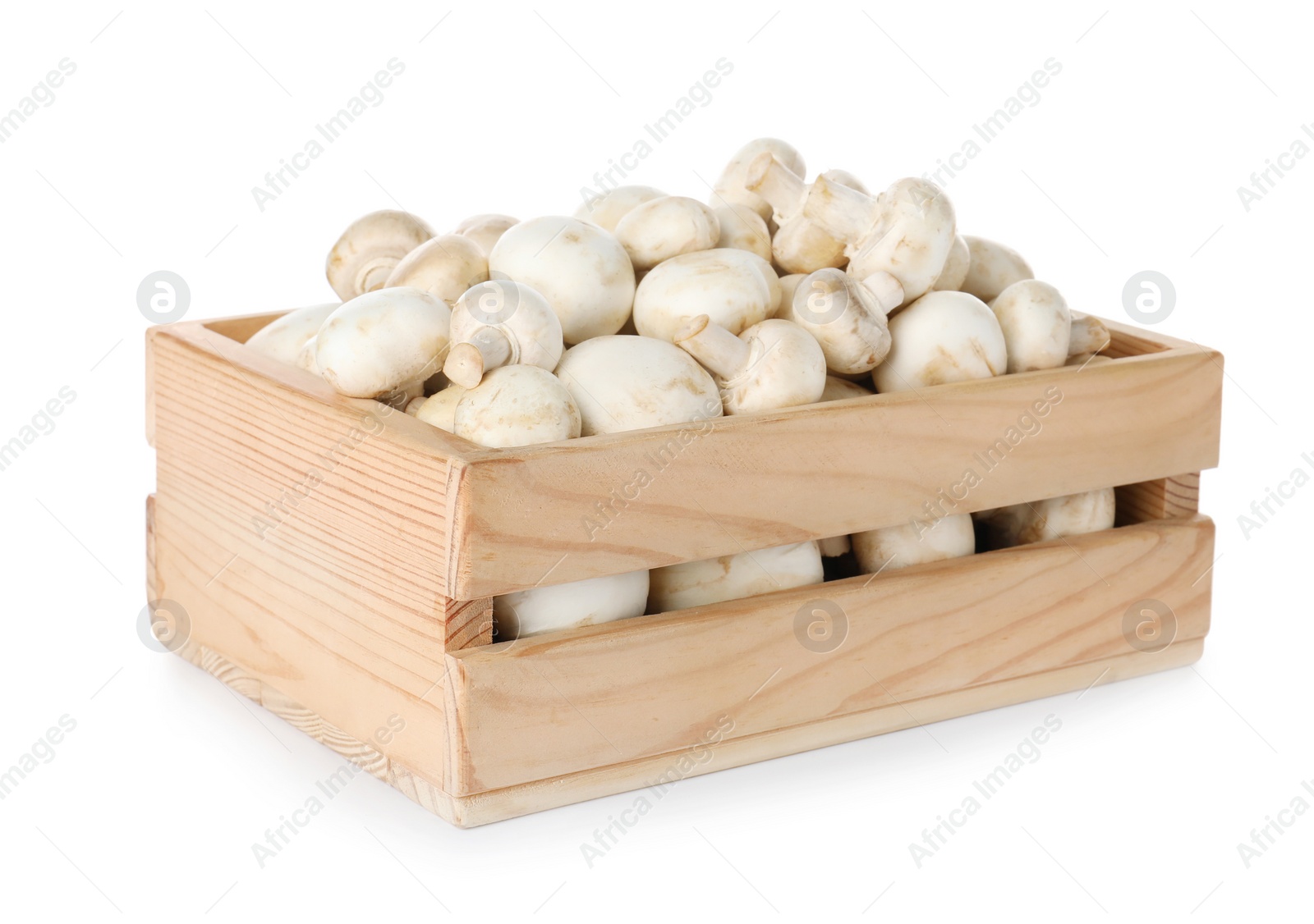 Photo of Wooden crate full of fresh raw mushrooms on white background