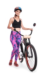 Portrait of sporty woman with bicycle on white background