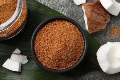 Flat lay composition with natural coconut sugar on grey table