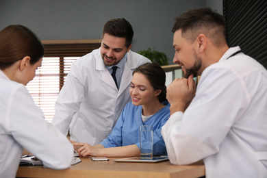 Team of professional doctors having meeting in office