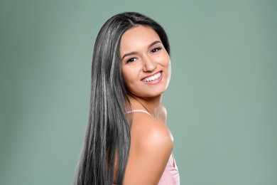 Image of Portrait of beautiful model with grey hair on green background