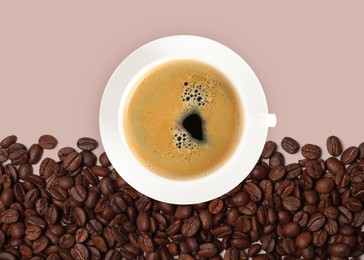 Cup of tasty espresso and roasted coffee beans on beige background, flat lay