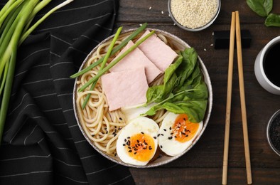 Photo of Delicious ramen with meat served on wooden table, flat lay. Noodle soup
