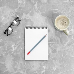 Photo of Flat lay composition with office stationery and cup of coffee on marble table