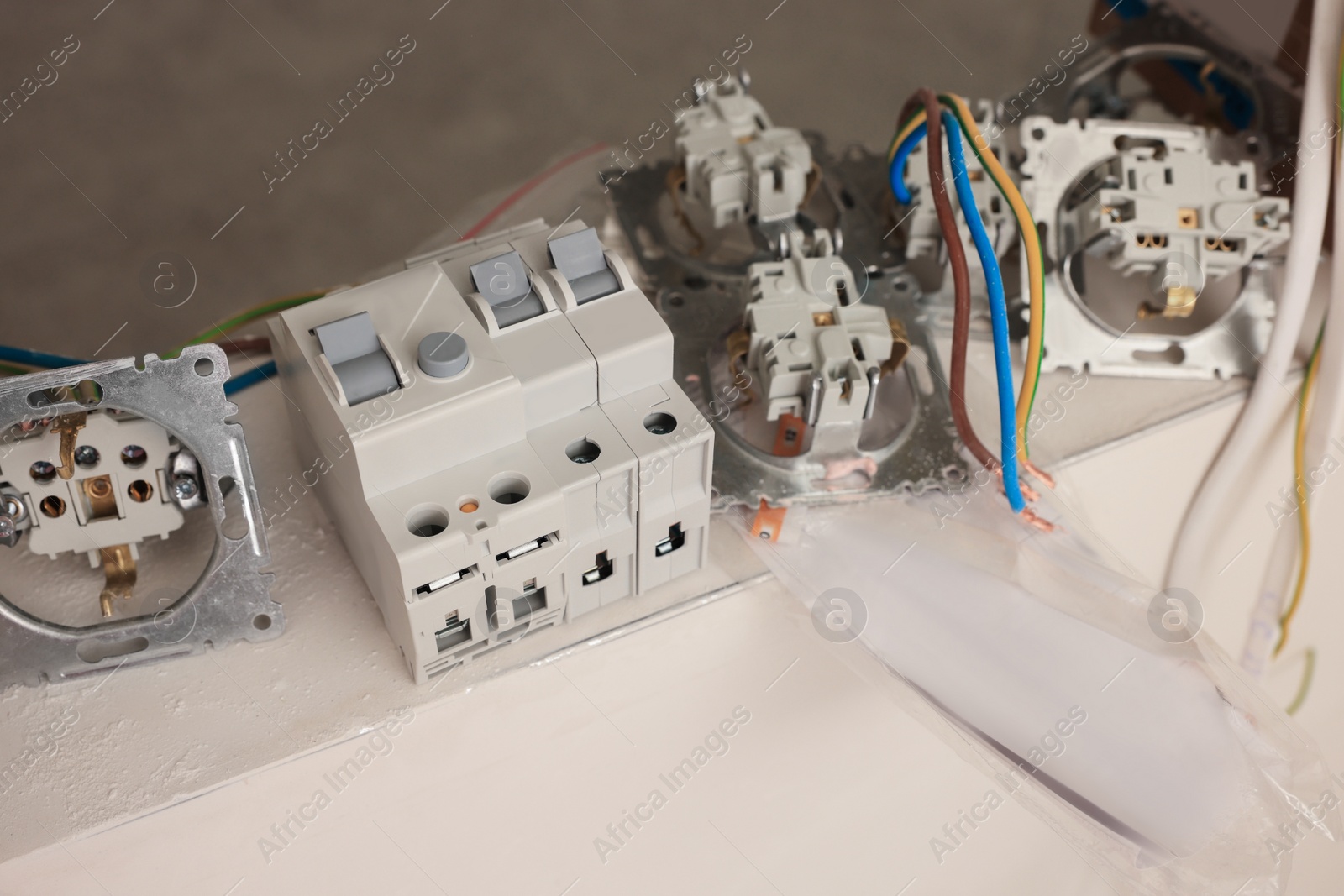 Photo of Power sockets with wires and residual-current device indoors