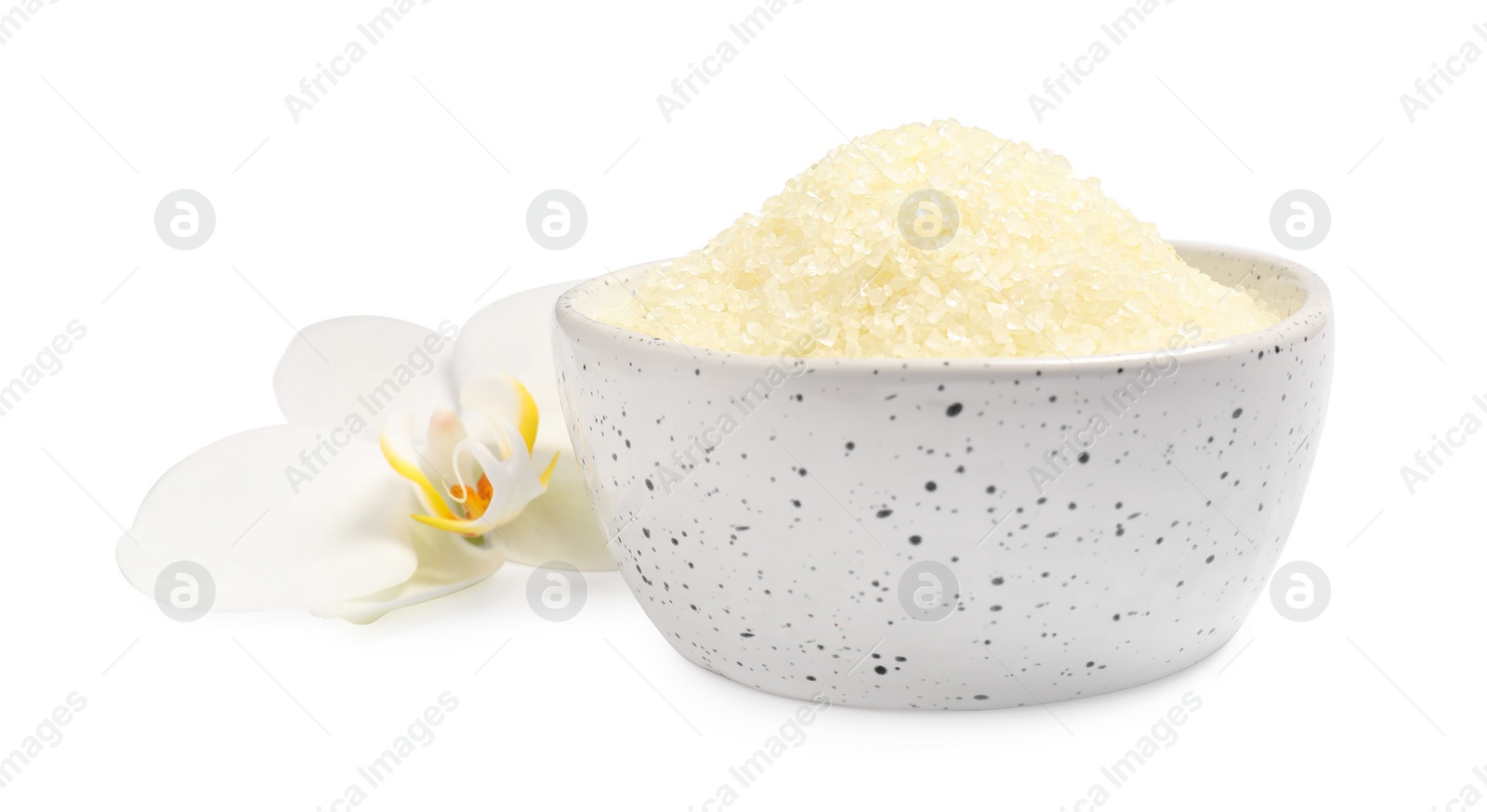 Photo of Sea salt in bowl and flower isolated on white
