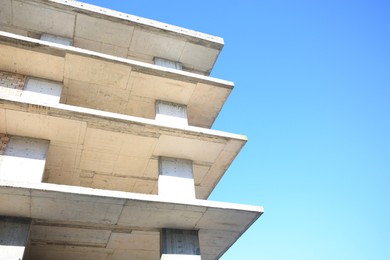 Exterior of reconstruction building against blue sky, low angle view. Space for text