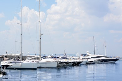 Photo of Beautiful view of city pier with moored boats on sunny day