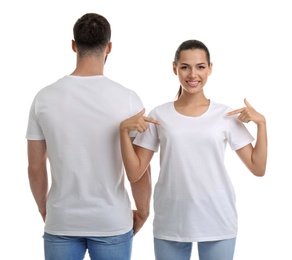 Young couple in t-shirts on white background. Mockup for design