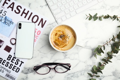 Flat lay composition with cup of coffee on table