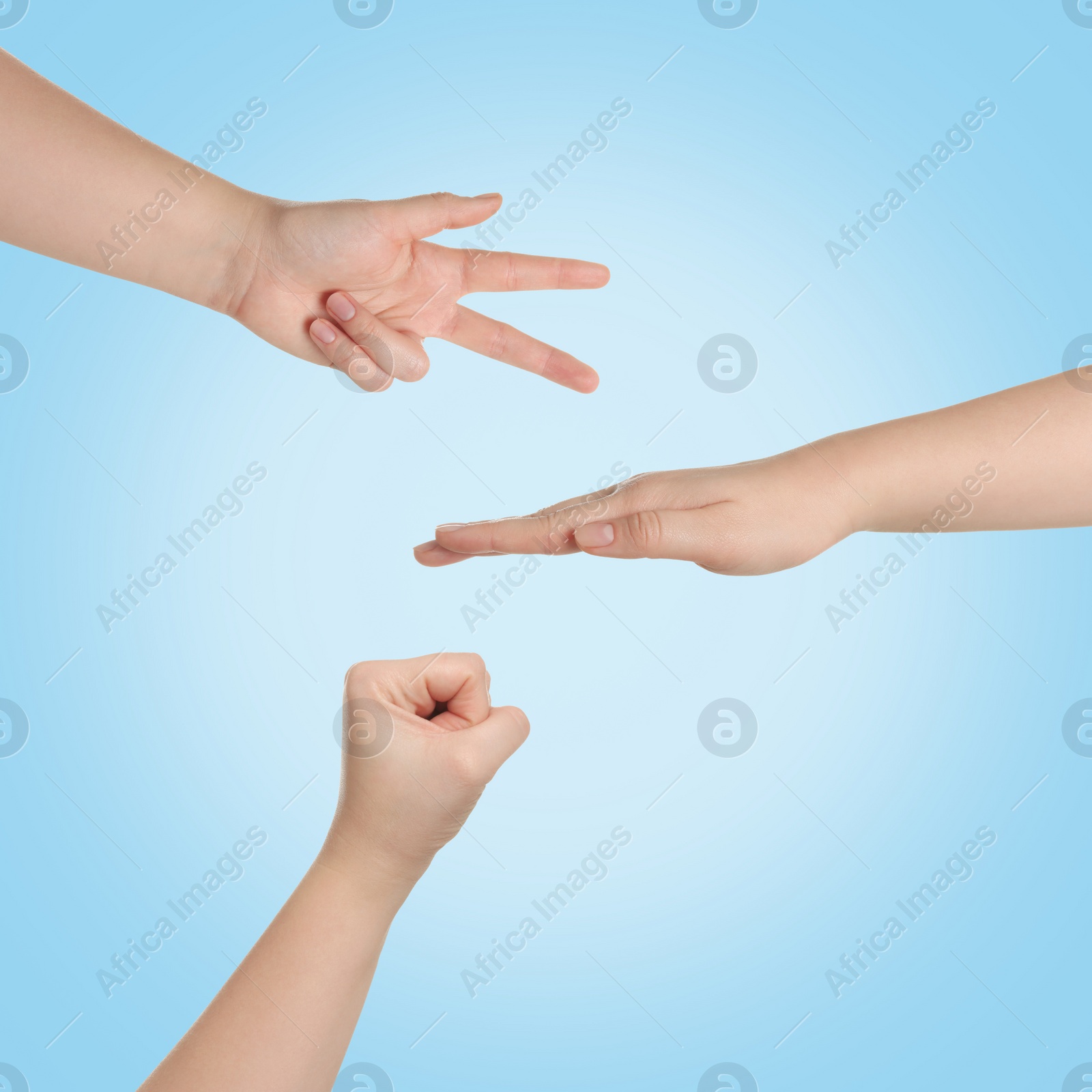 Image of People playing rock, paper and scissors on light blue background, top view