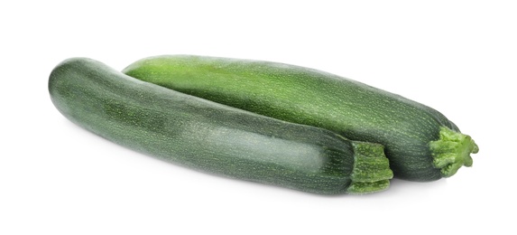 Photo of Raw green ripe zucchinis isolated on white