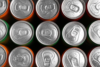 Photo of Energy drink in wet cans, top view. Functional beverage