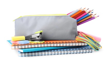 Photo of Pencil case and different school stationery on white background