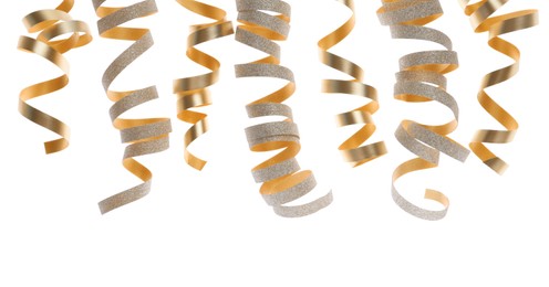 Photo of Shiny serpentine streamers on white background. Festive decor