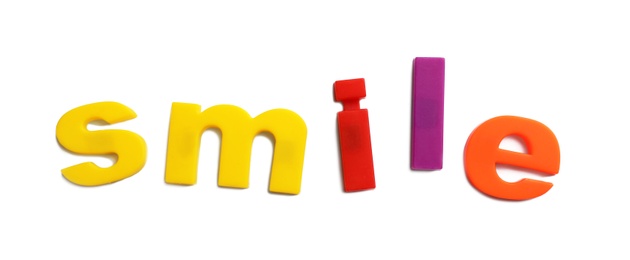 Photo of Word SMILE of magnetic letters on white background, top view