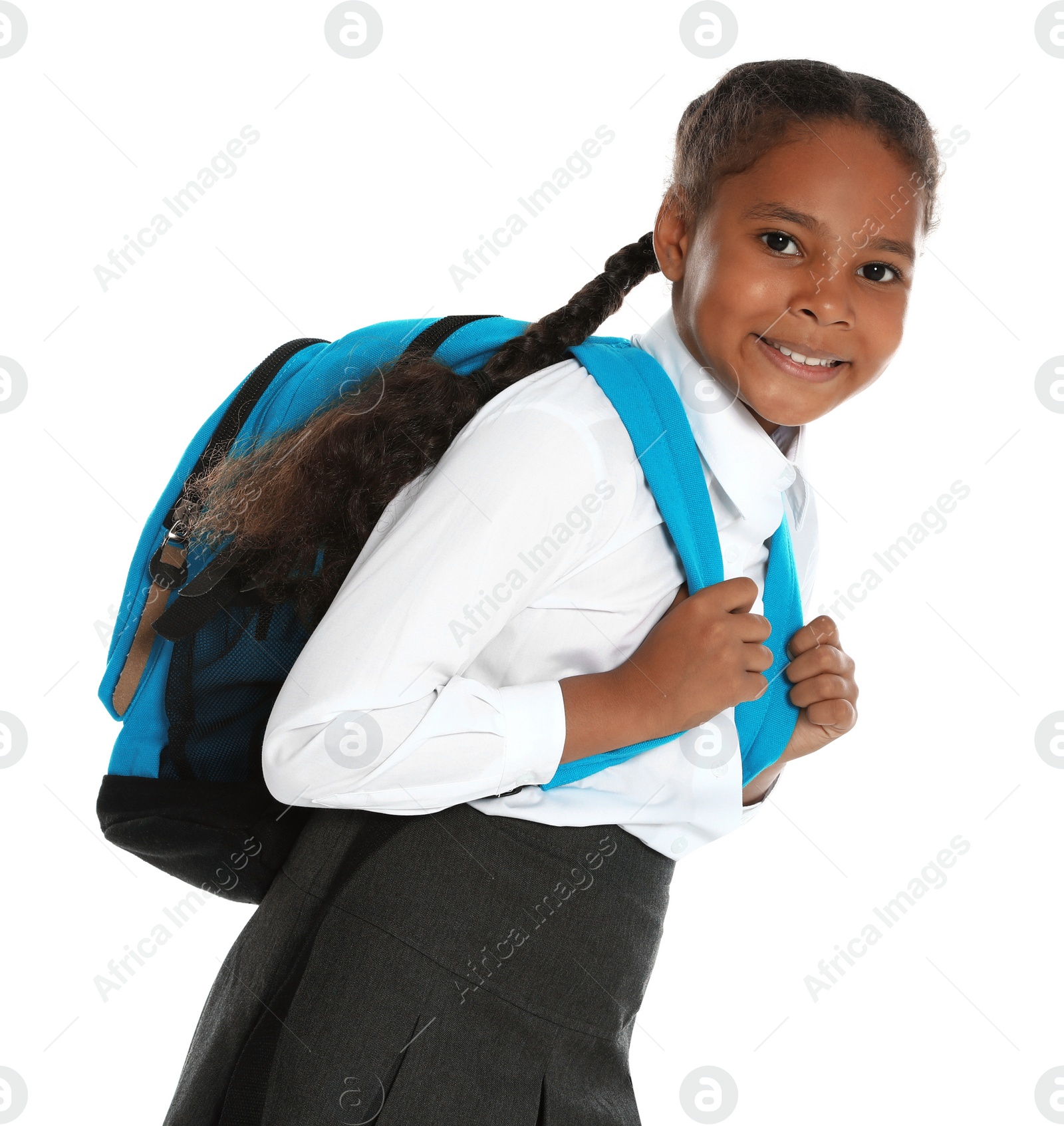 Photo of Happy African-American girl in school uniform on white background