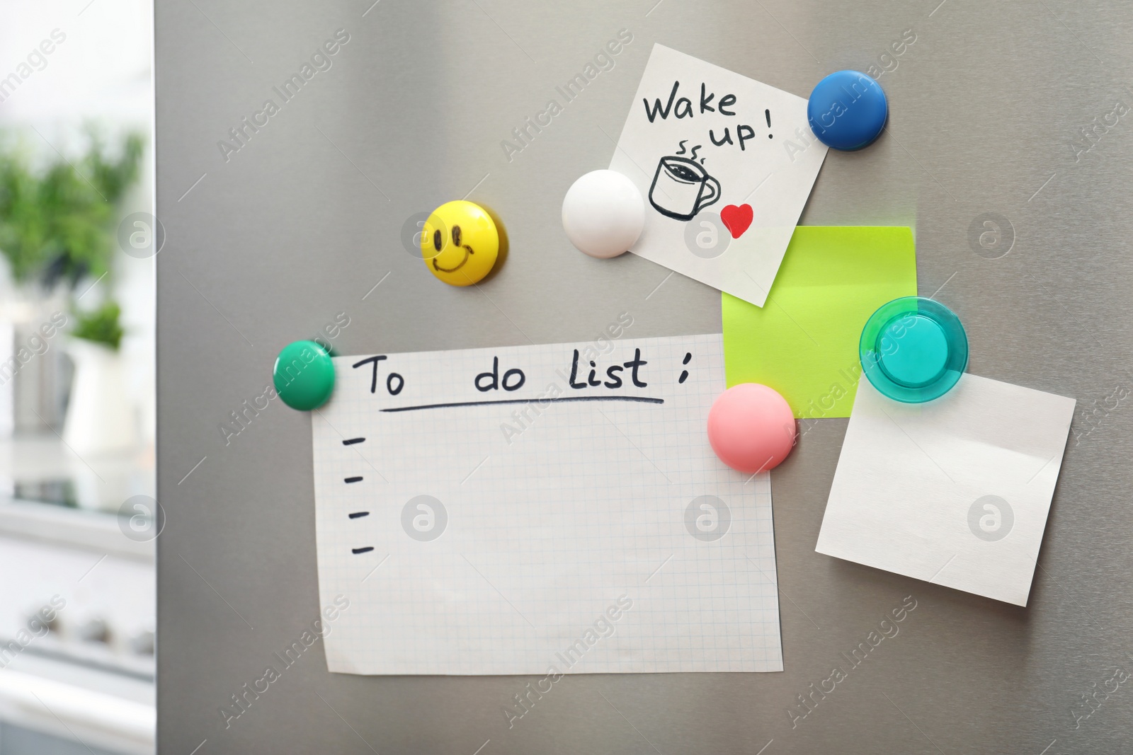 Photo of To do list, sheets of paper, note and magnets on refrigerator door in kitchen. Space for text