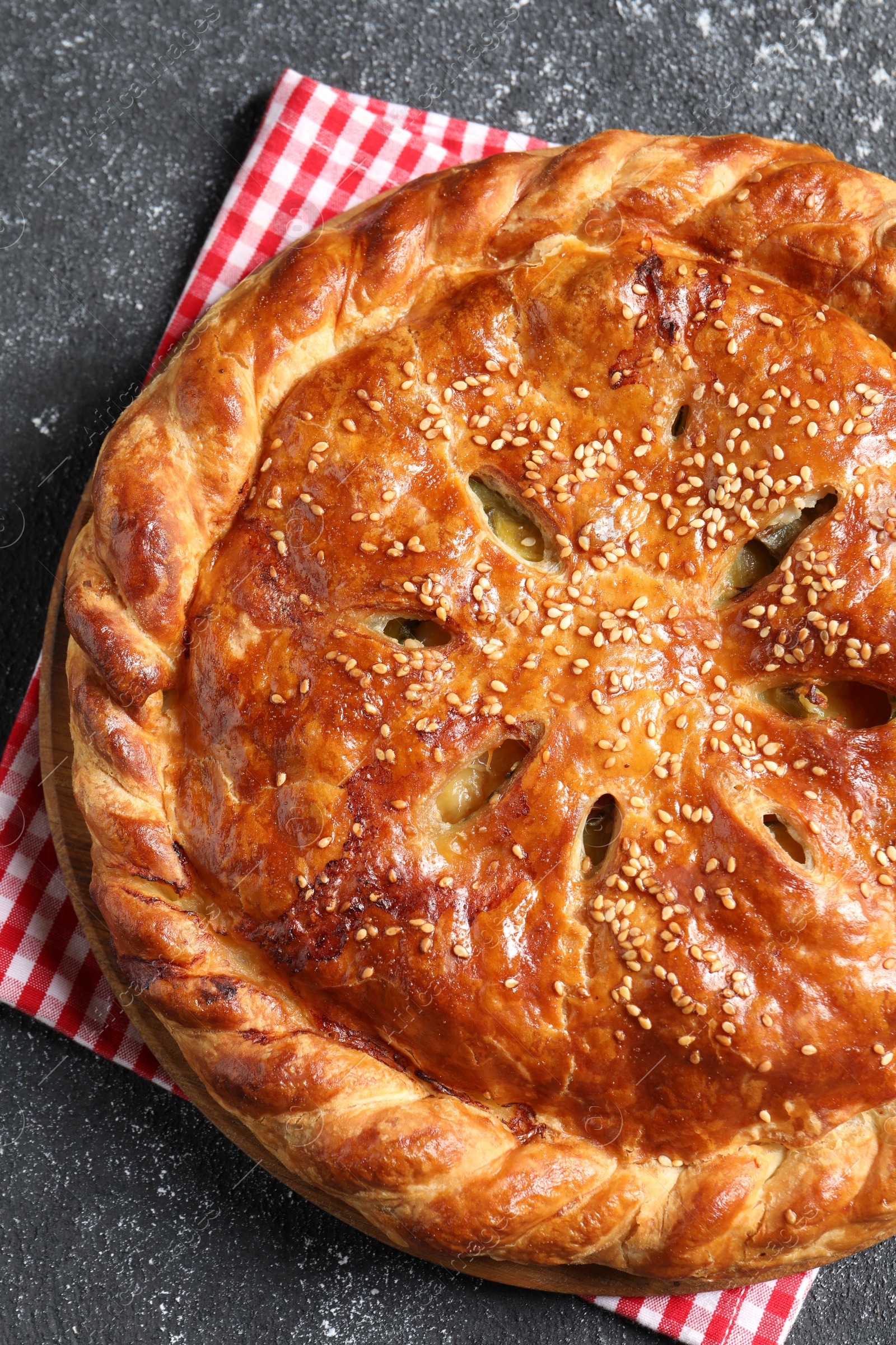 Photo of Tasty homemade pie on grey table, top view