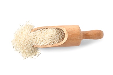 Photo of Scoop with uncooked long grain rice on white background, top view