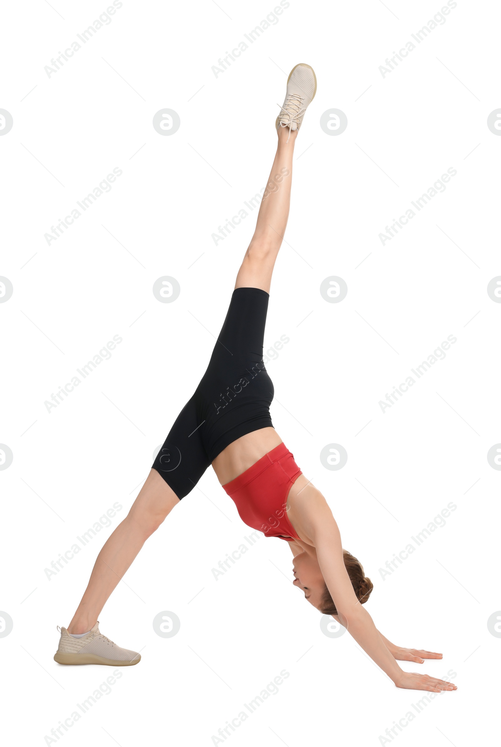 Photo of Yoga workout. Young woman stretching on white background