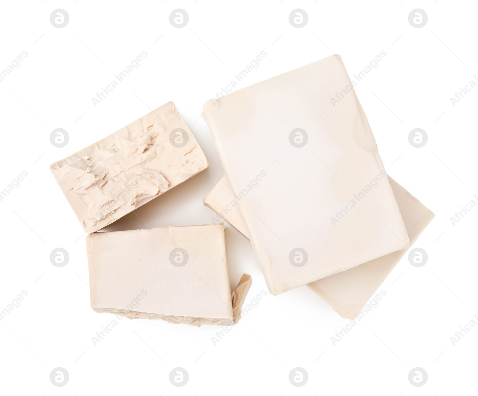 Photo of Blocks of compressed yeast on white background, top view