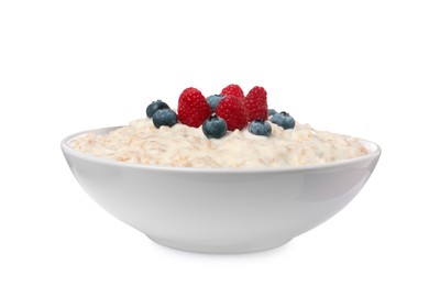 Photo of Tasty boiled oatmeal with berries in bowl isolated on white