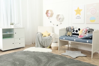 Photo of Child room interior with toys and stylish furniture