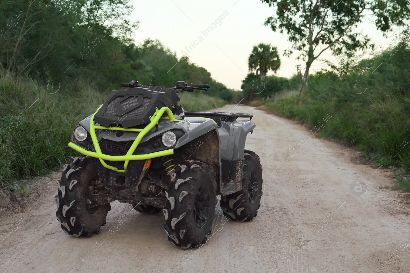 Photo of Modern fast quad bike on pathway outdoors