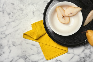 Flat lay composition with ripe pears on marble background. Space for text