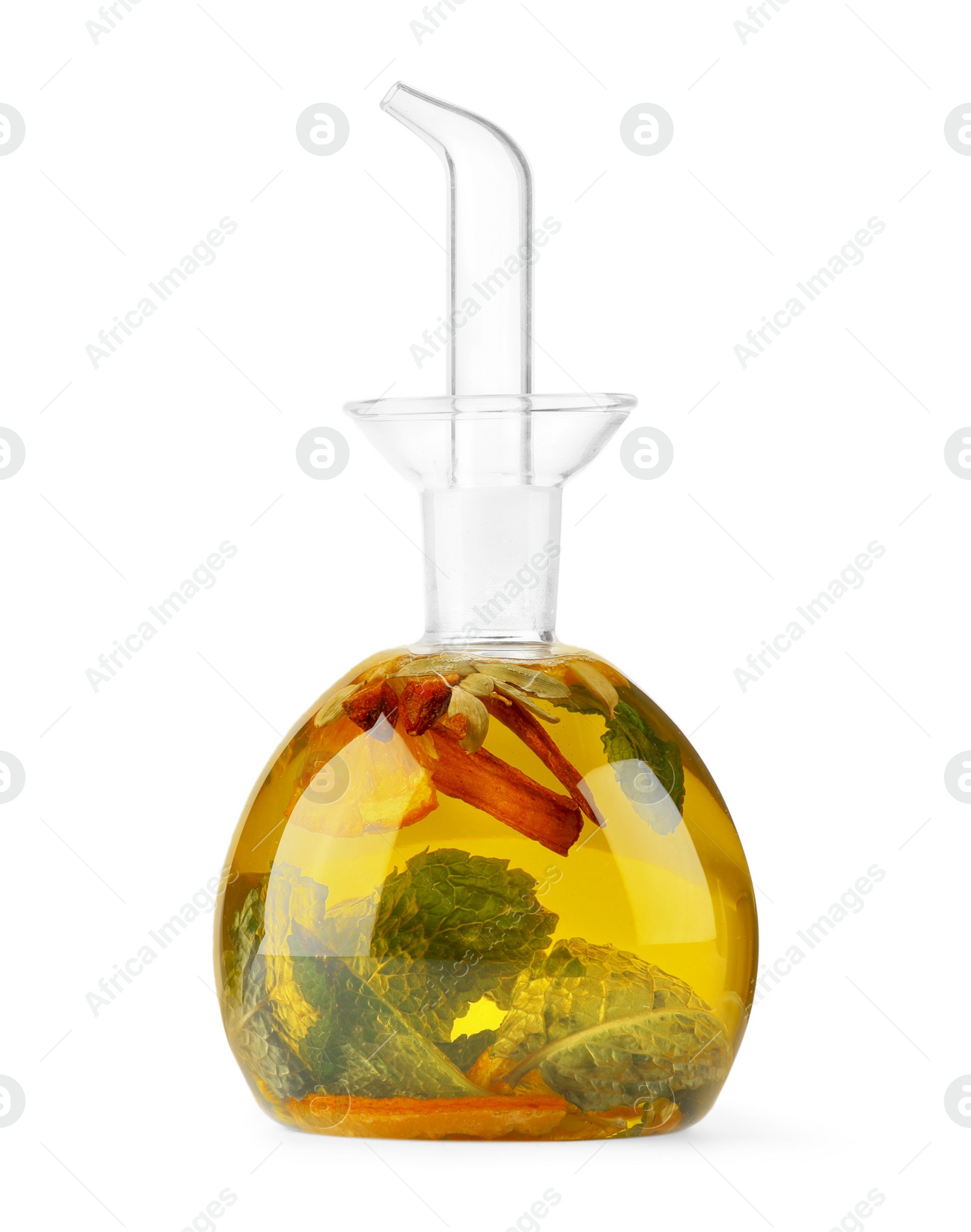 Photo of Glass bottle of cooking oil with spices and herbs isolated on white