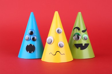 Photo of Spooky paper Halloween monsters on red background