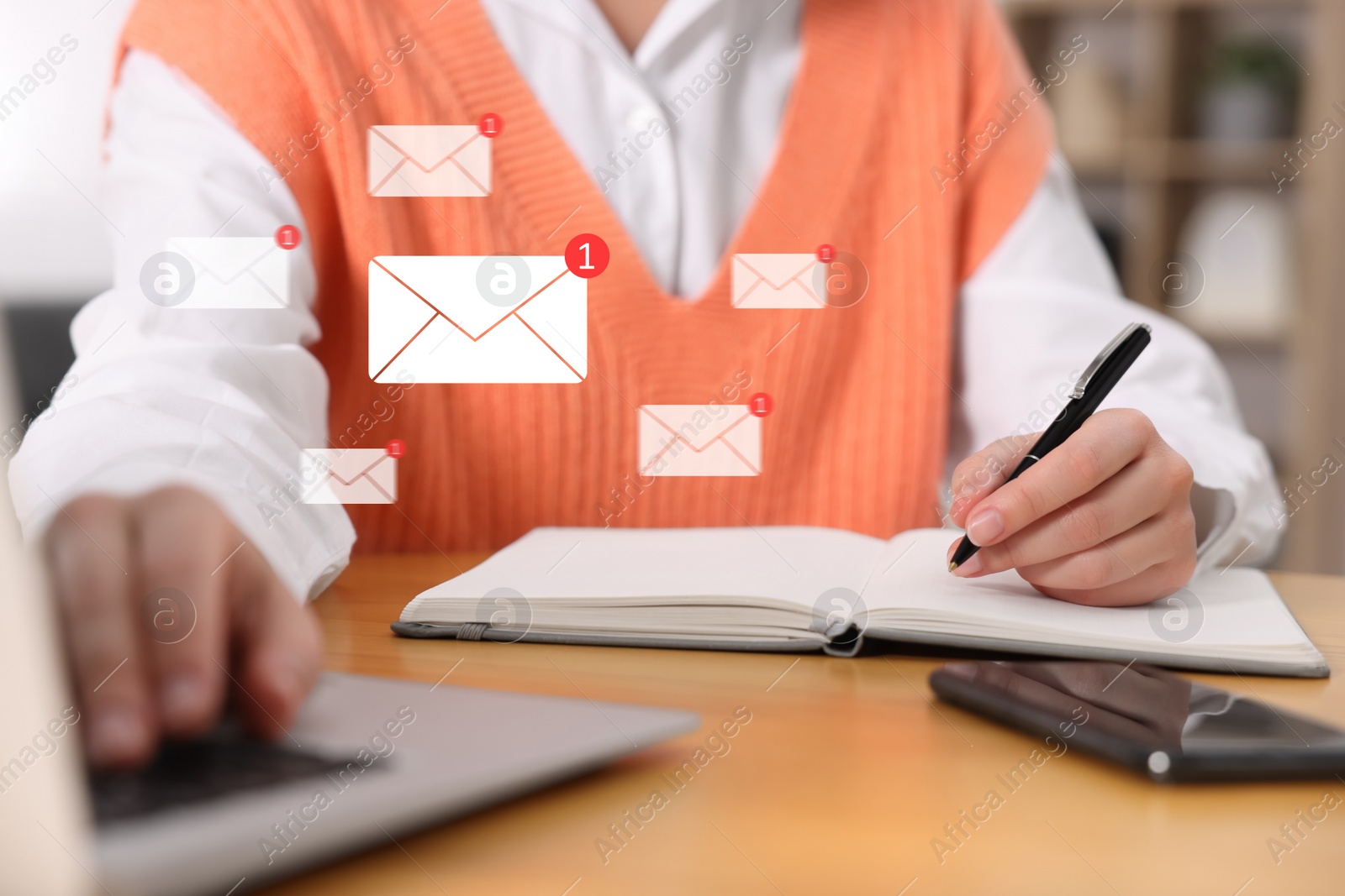 Image of Email. Woman working at table, closeup. Incoming letter notifications over laptop
