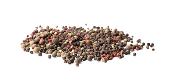 Mix of different pepper grains isolated on white